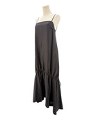 Black dress on a mannequin against a white background