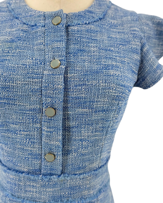 Blue Woven tweed, jewel neckline, partial button placket, playful flutter sleeves accented with with subtle fray trim, hidden back zipper with hook and eye mini dress on a mannequin on a white background