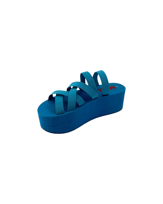 A pair of bright blue strappy sandals with a thick platform sole, shown from a top-down view on a plain white background.