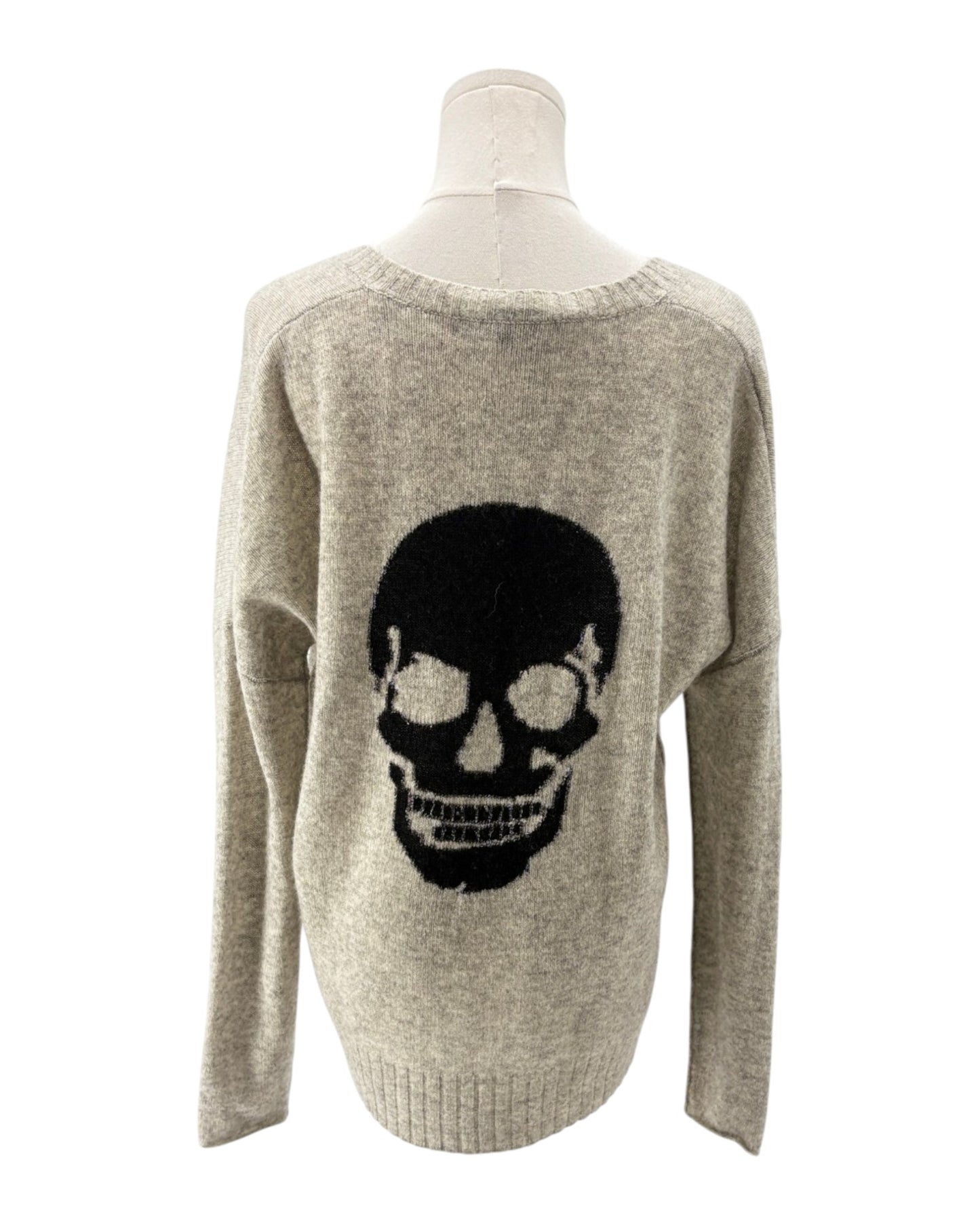 Gray sweater with a black skull design on a mannequin against a white background
