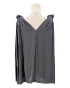 Black top with knot details on a mannequin against a white background