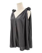 Black top with knot details on a mannequin against a white background
