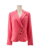 Pink blazer on a mannequin against a white background