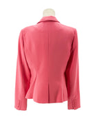 Pink blazer on a mannequin against a white background