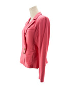 Pink blazer on a mannequin against a white background