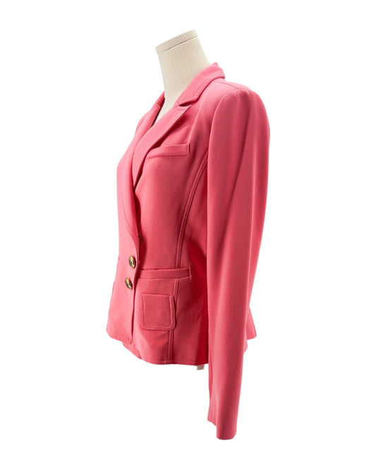 Pink blazer on a mannequin against a white background