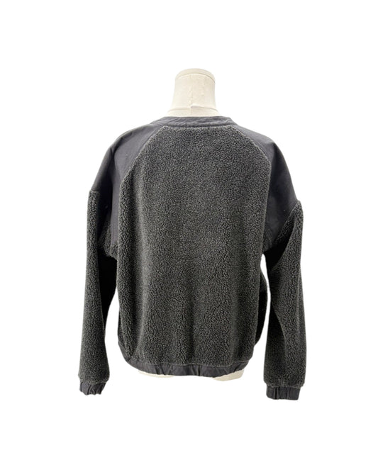 A dark gray fleece crewneck sweatshirt with contrasting black raglan sleeves, displayed on a mannequin torso against a white background.