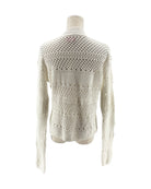 White knitted sweater on a mannequin against a white background