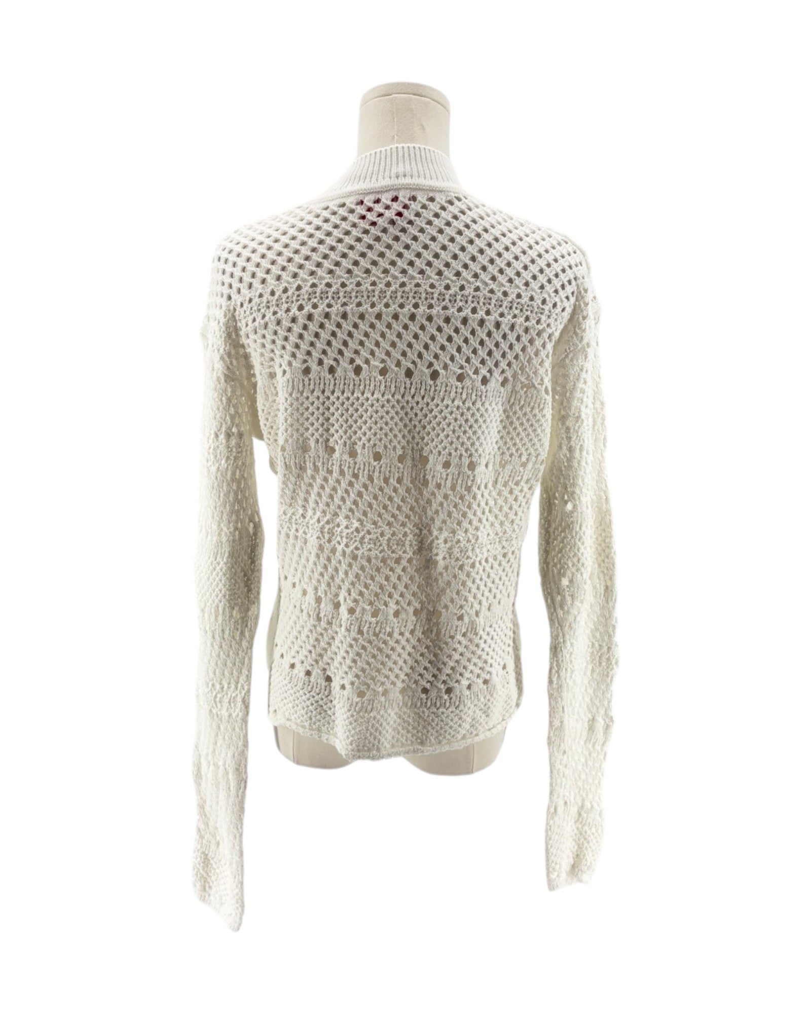 White knitted sweater on a mannequin against a white background