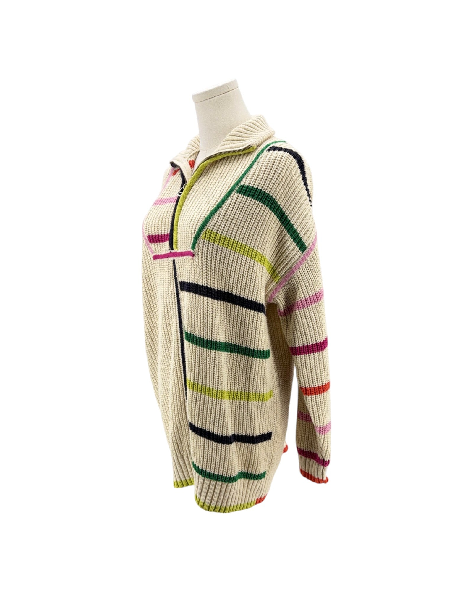 A cream-colored knit zip-up sweater with horizontal stripes in green, pink, black, and yellow, displayed on a mannequin torso against a white background.