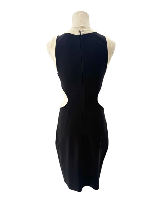 Black sleeveless dress on a mannequin with a white background