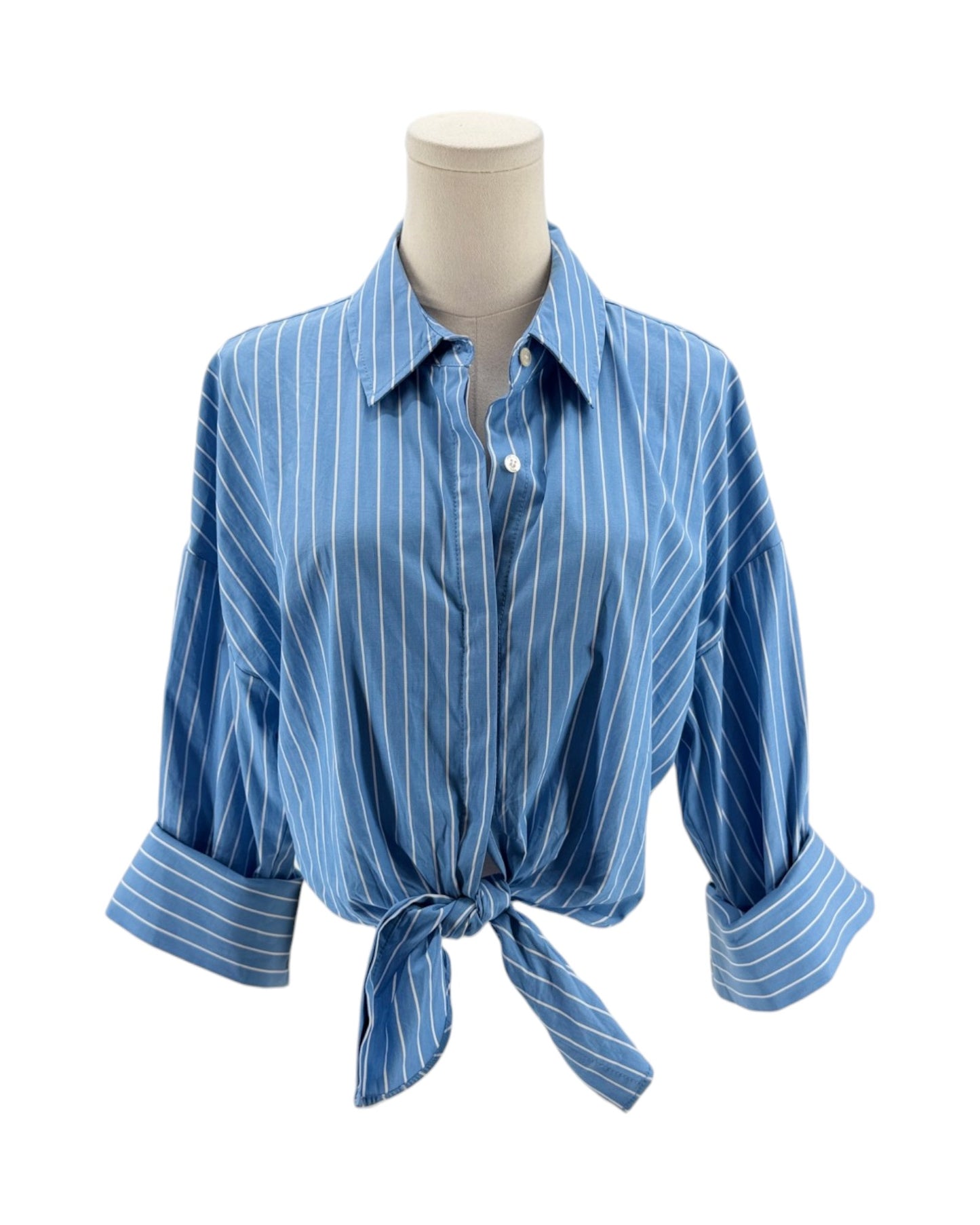Blue striped shirt on a mannequin against a white background