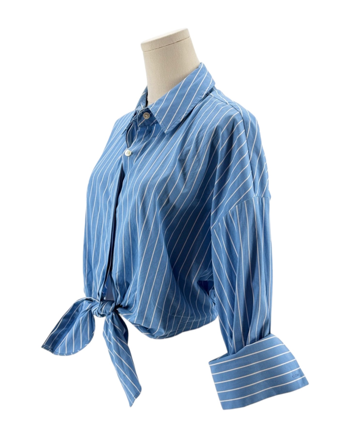 Blue striped shirt on a mannequin against a white background