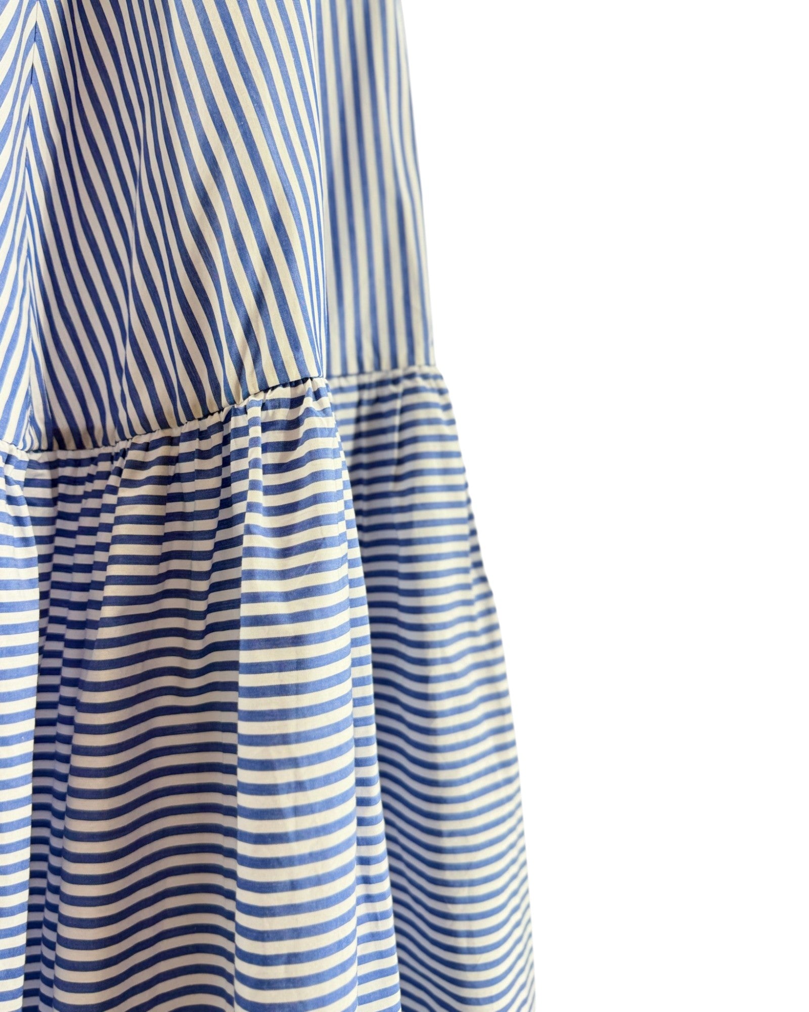 Blue and white striped dress on a white background