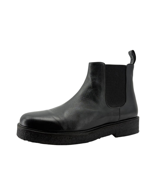 Black Chelsea boot on a white background