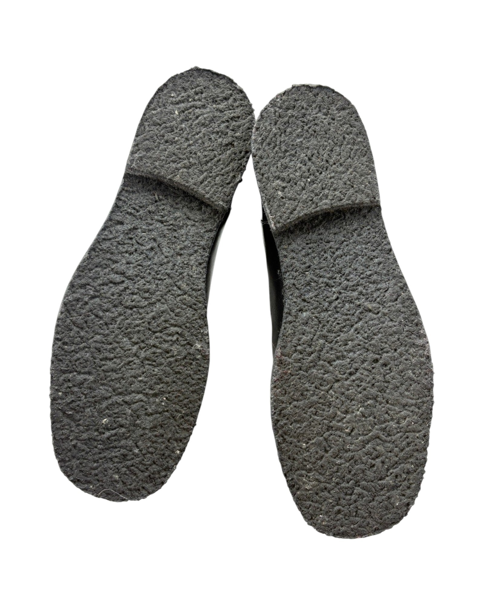 Pair of black shoe insoles on a white background