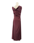 Staud maroon evening gown on a mannequin against a white background