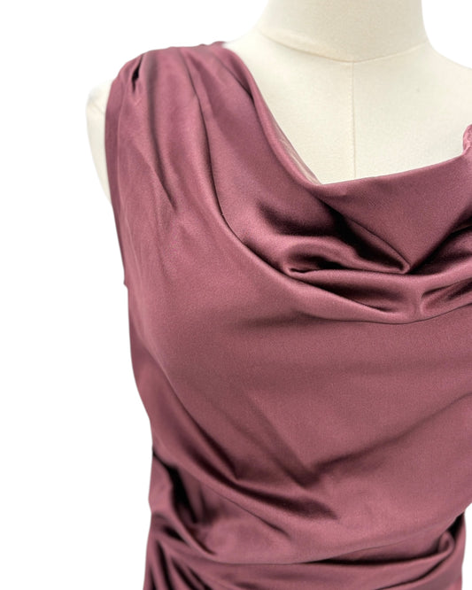 Staud maroon evening gown on a mannequin against a white background