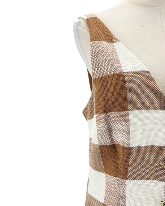 Plaid patterned fabric on a mannequin with a white background