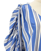 Blue and white striped dress on a mannequin with a plain background