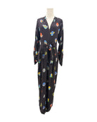 Black jumpsuit with colorful abstract patterns on a mannequin against a white background