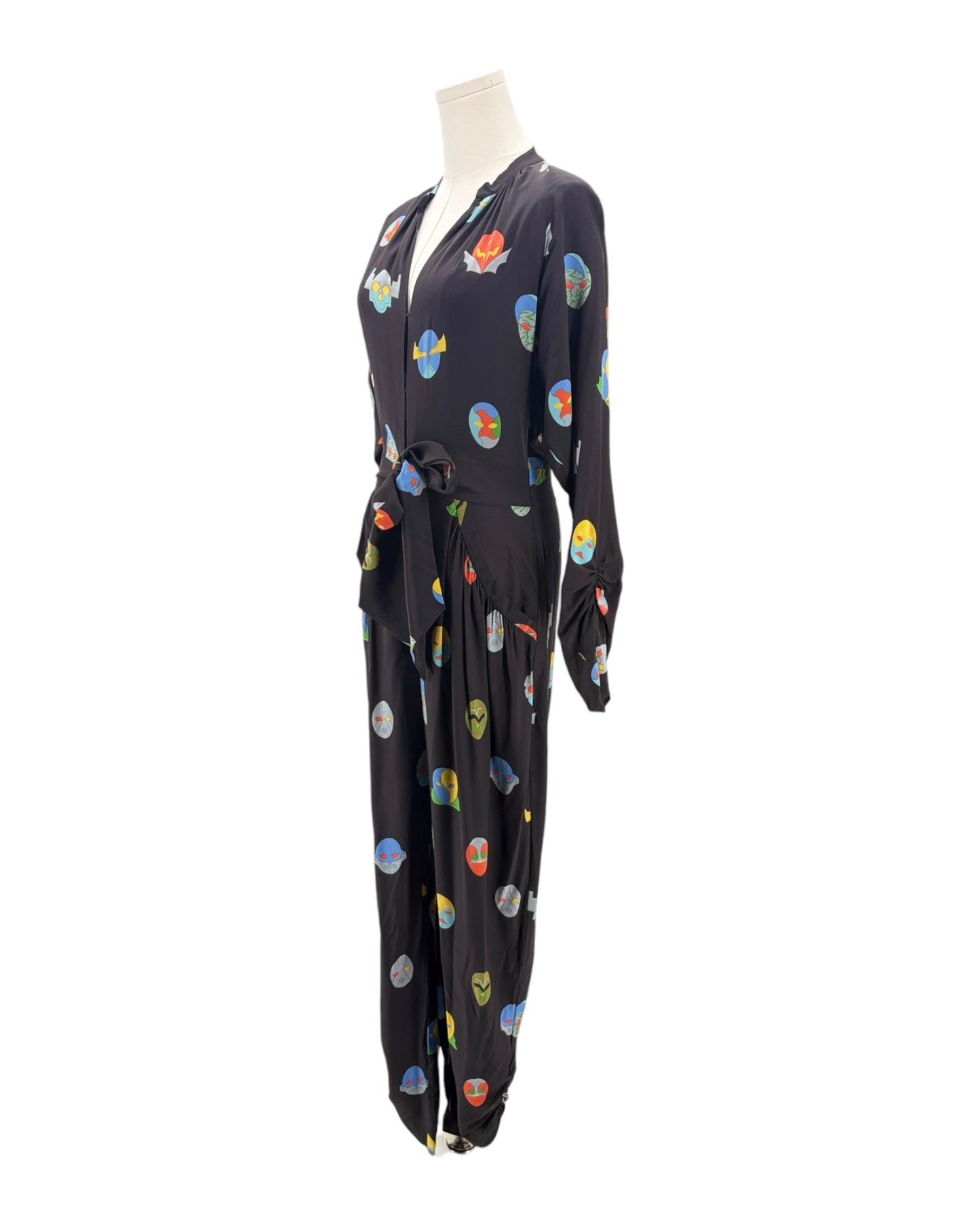 Black jumpsuit with colorful abstract patterns on a mannequin against a white background