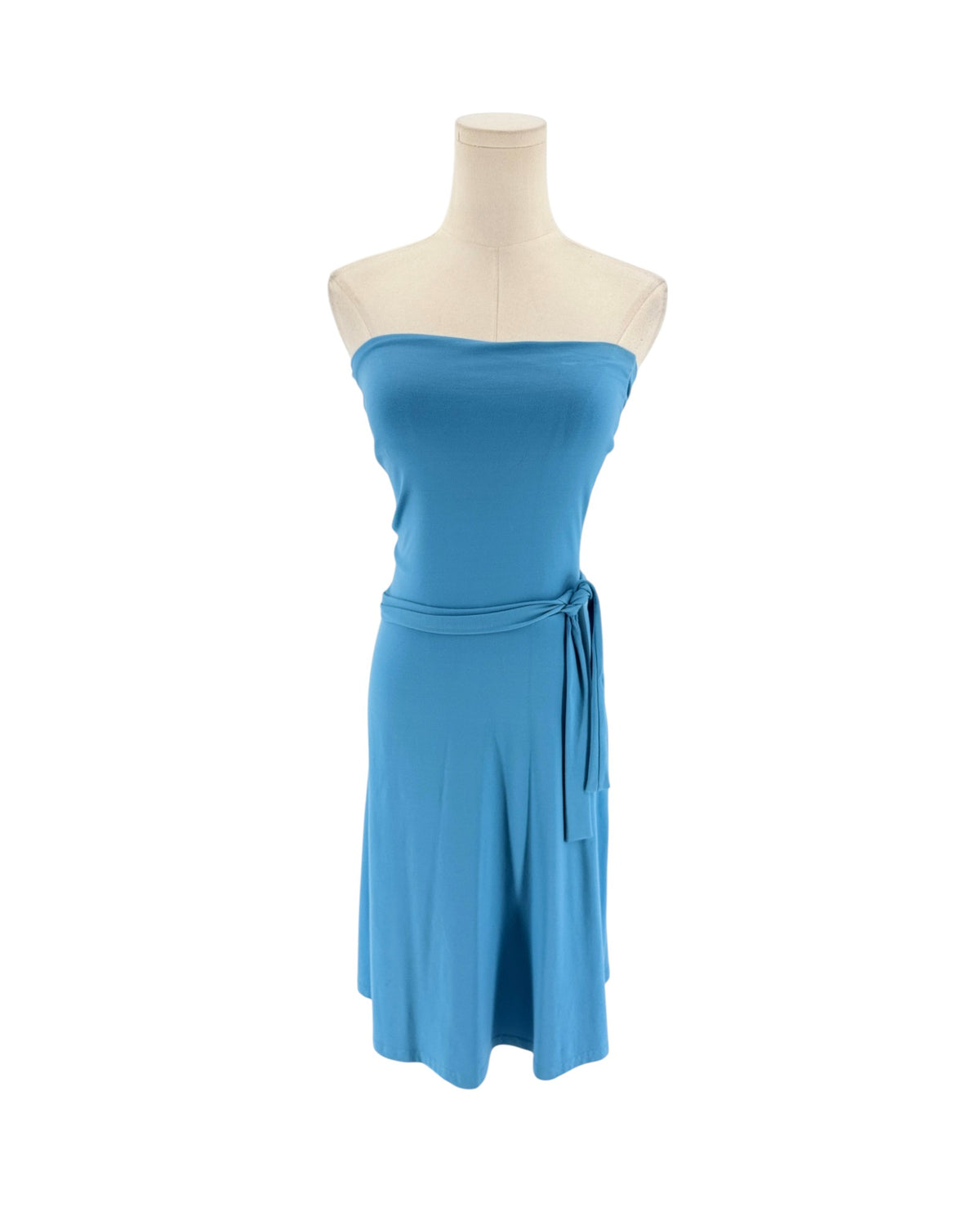 A bright blue strapless tube dress displayed on a cream mannequin torso against a plain white background.