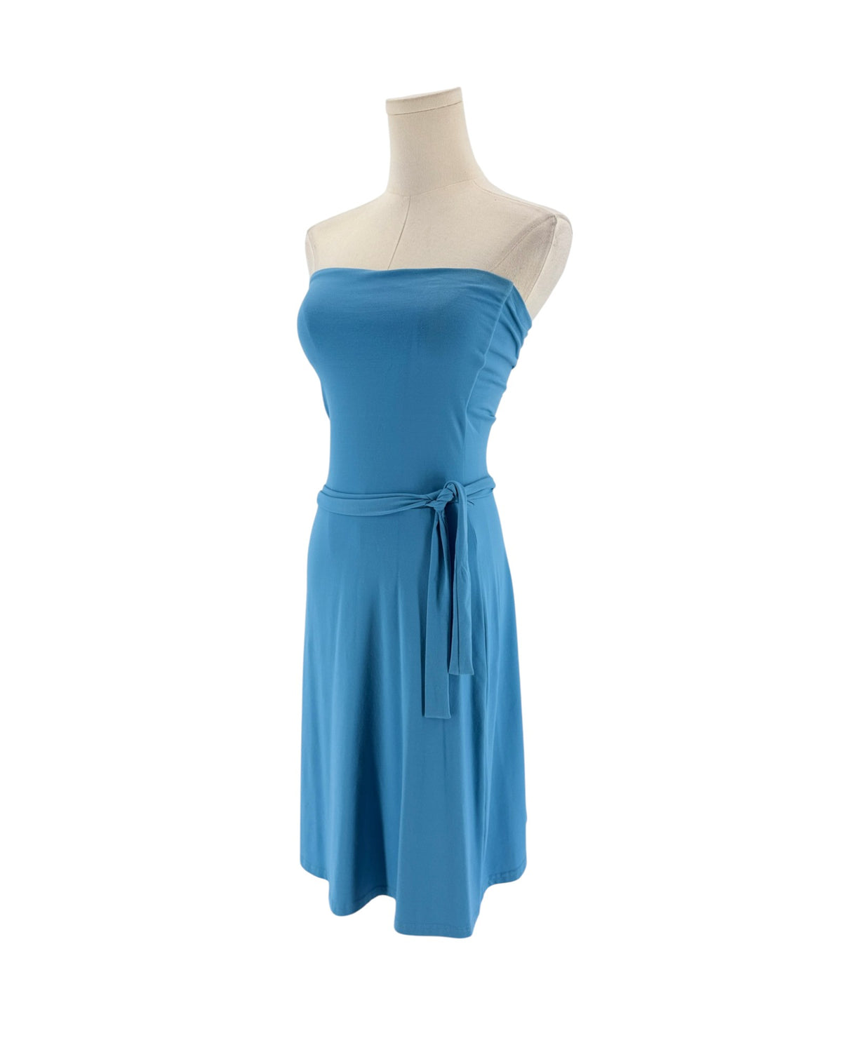 A blue strapless tube dress displayed on a cream mannequin torso against a plain white background.
