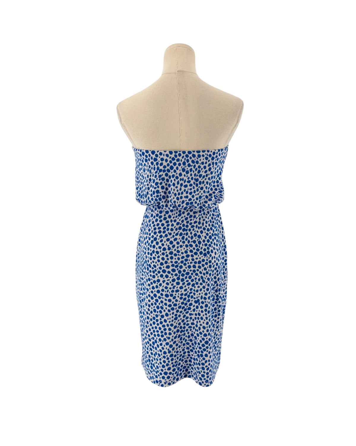 A strapless tube dress with a blue and white spotted pattern, displayed on a beige mannequin torso against a plain white background.