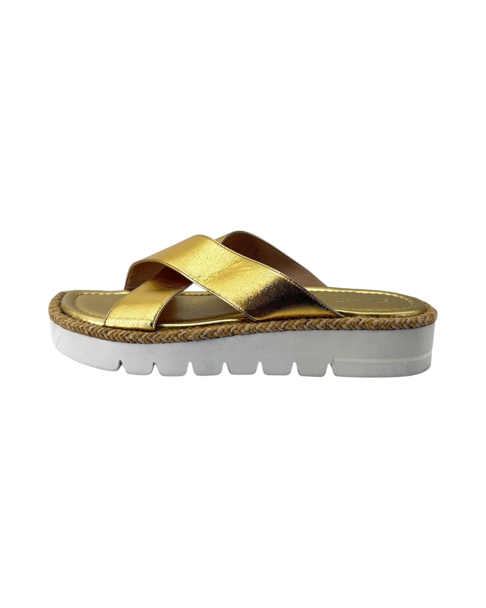 Gold sandal with white sole on a white background