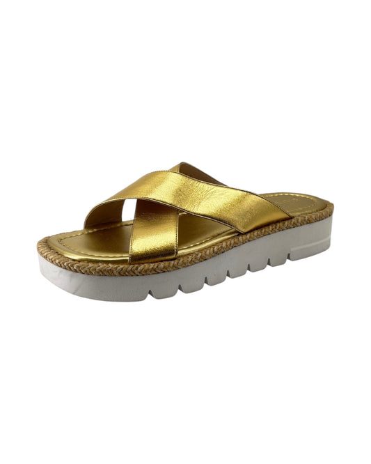 Gold sandal with white sole on a white background