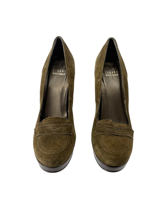 Pair of olive green suede shoes on a white background