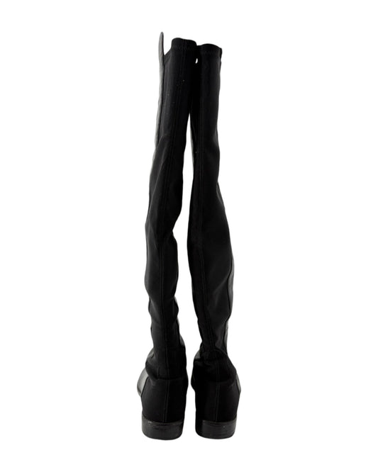 Black knee-high boots on a white background
