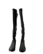Black knee-high boots on a white background