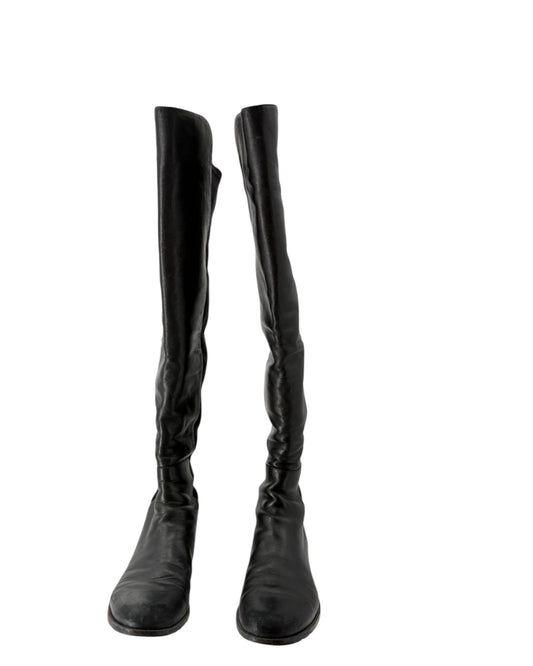 Black knee-high boots on a white background