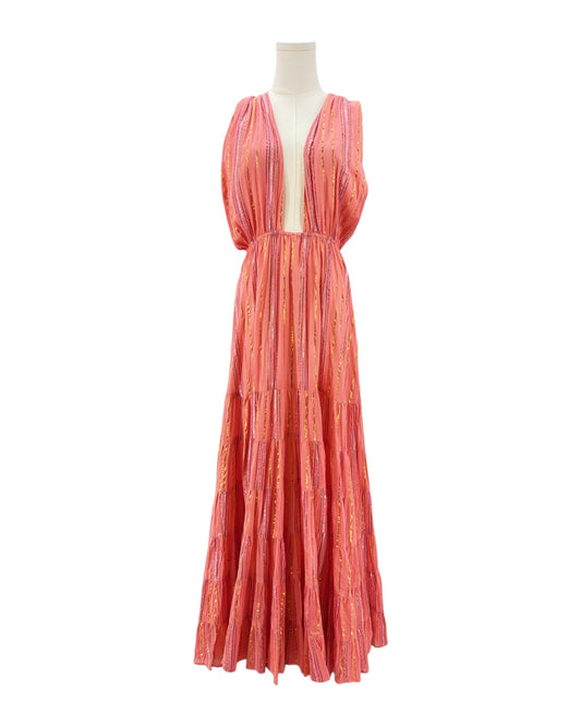 Long coral dress on a mannequin against a white background