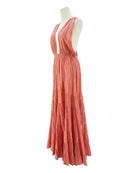 Coral striped dress on a mannequin against a white background