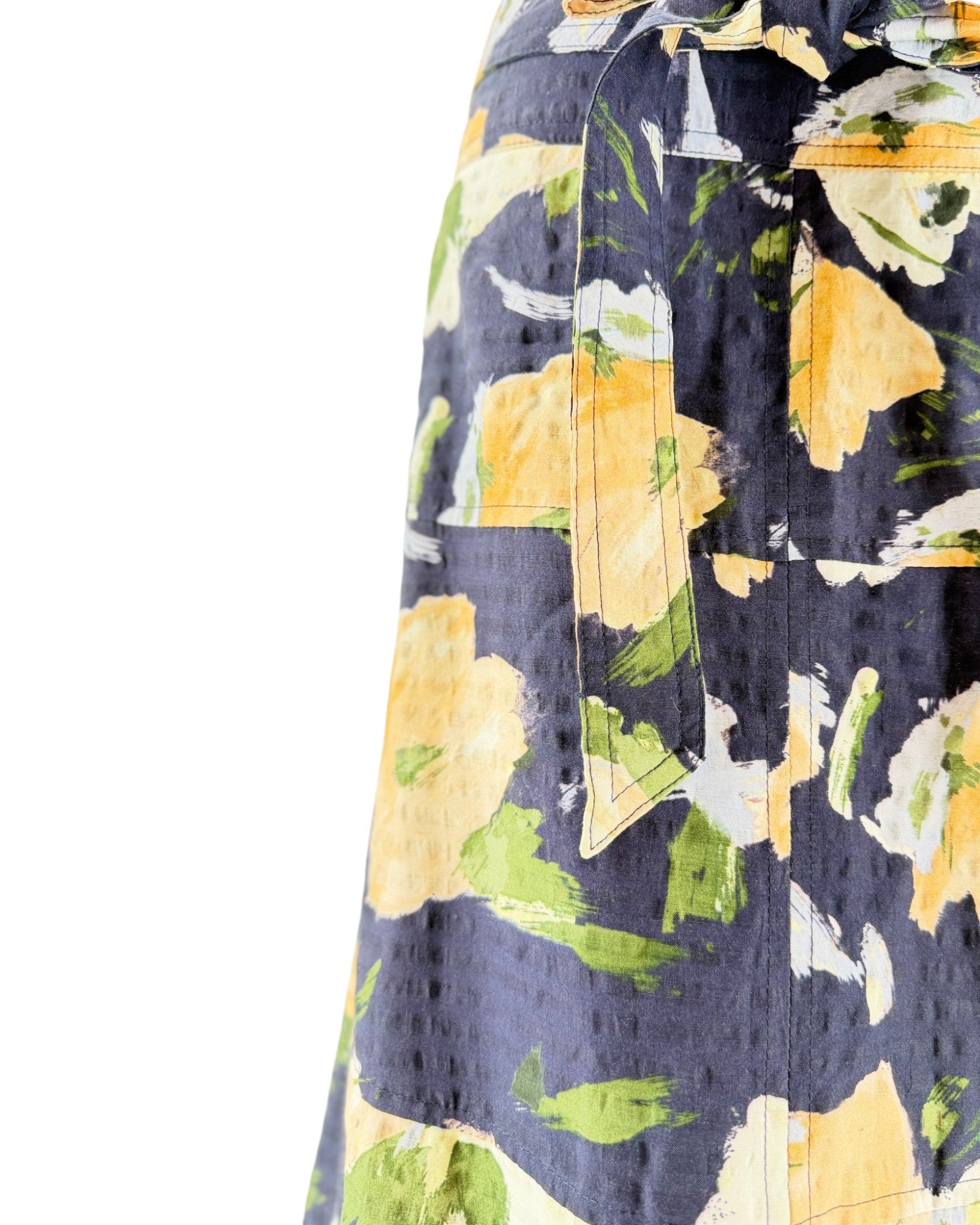 Navy shirt with colorful floral pattern on a white background