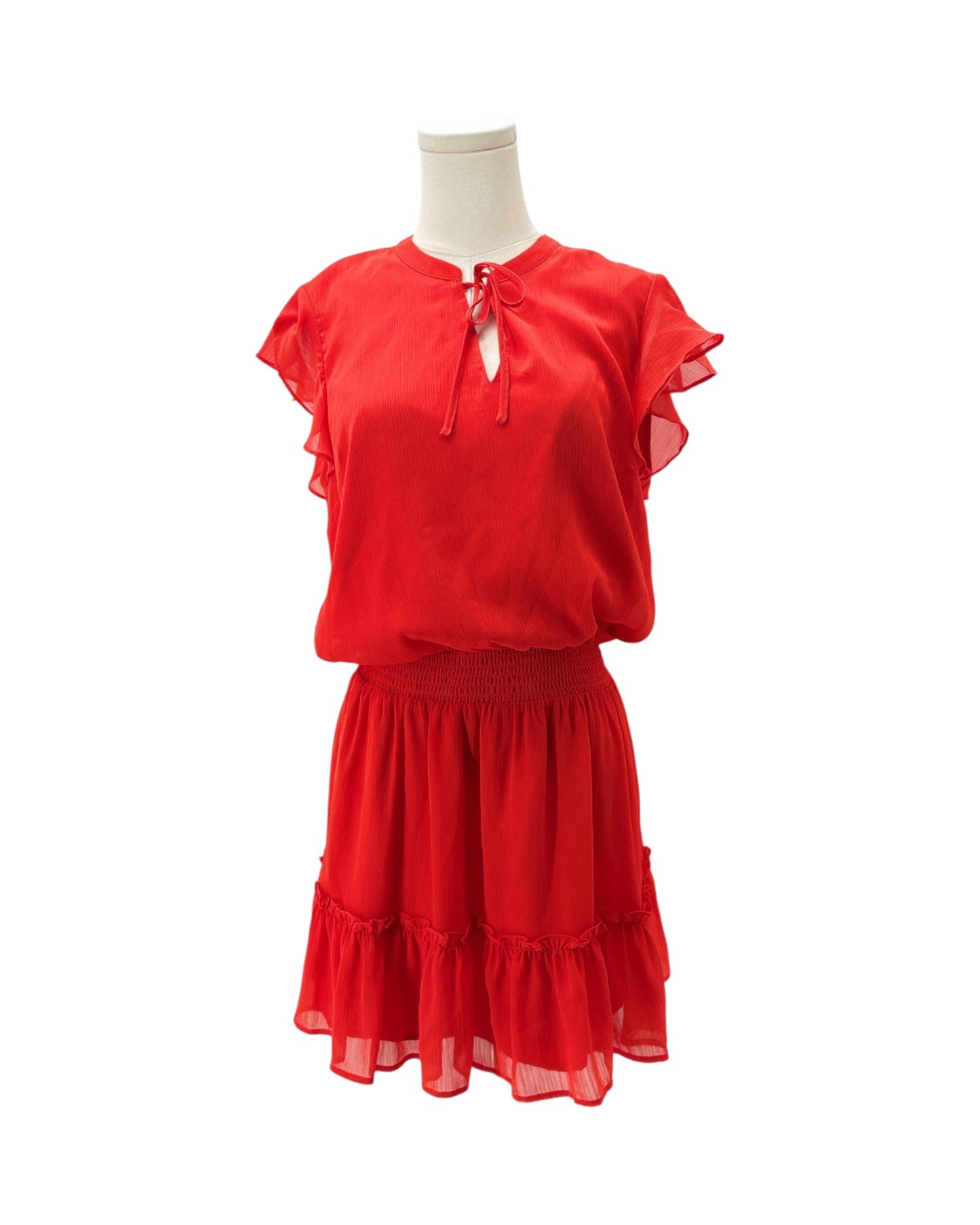 A bright red two-piece set consisting of a short-sleeve blouse with ruffled sleeves and a keyhole tie neckline, paired with a matching tiered ruffled skirt, displayed on a mannequin against a white background.