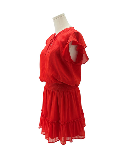 A bright red two-piece dress set displayed on a white mannequin torso against a plain white background. The set includes a short-sleeve top with ruffled sleeves and a matching tiered ruffle skirt.