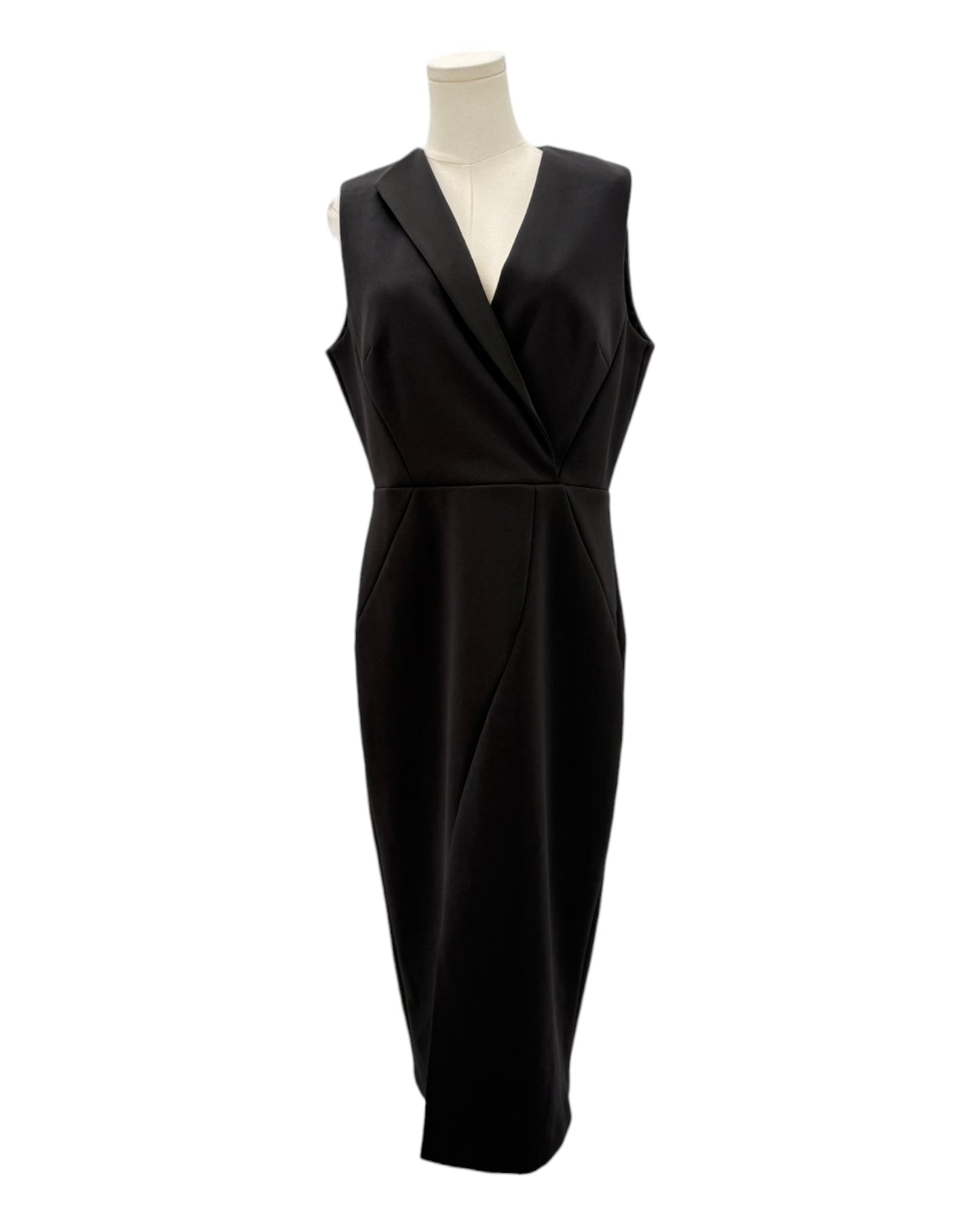 Black dress on a mannequin against a white background