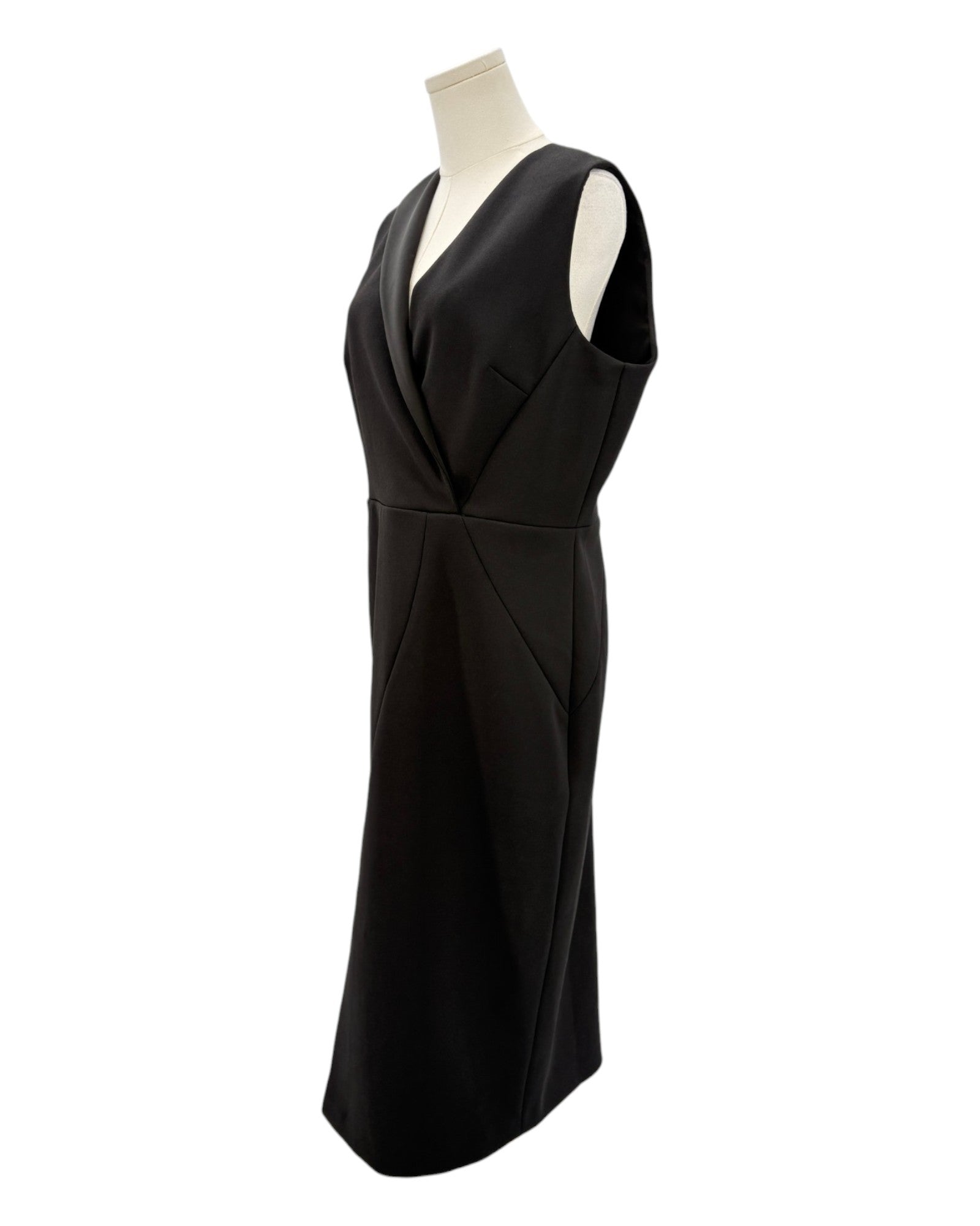 Black dress on a mannequin against a white background