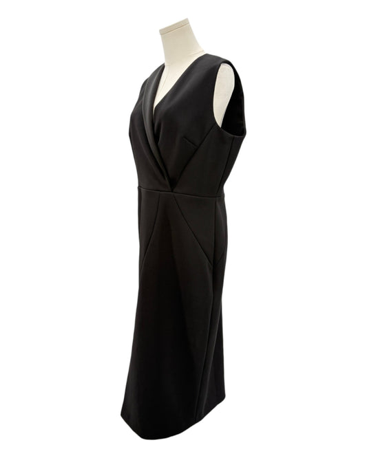 Black dress on a mannequin against a white background