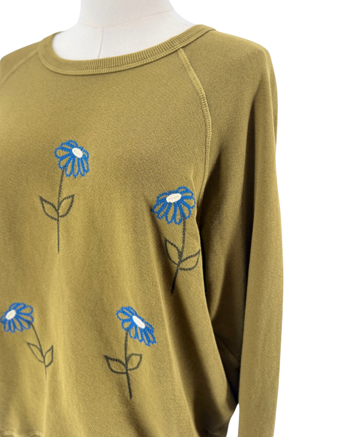 Green Classic crew-neck sweatshirt, blue embroidery flowers across the front on a white background on a mannequin
