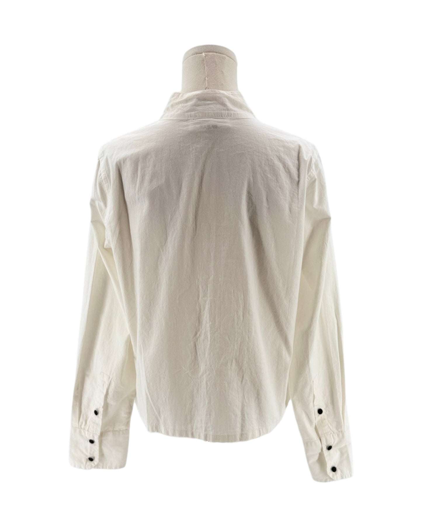 White shirt on a mannequin with a white background
