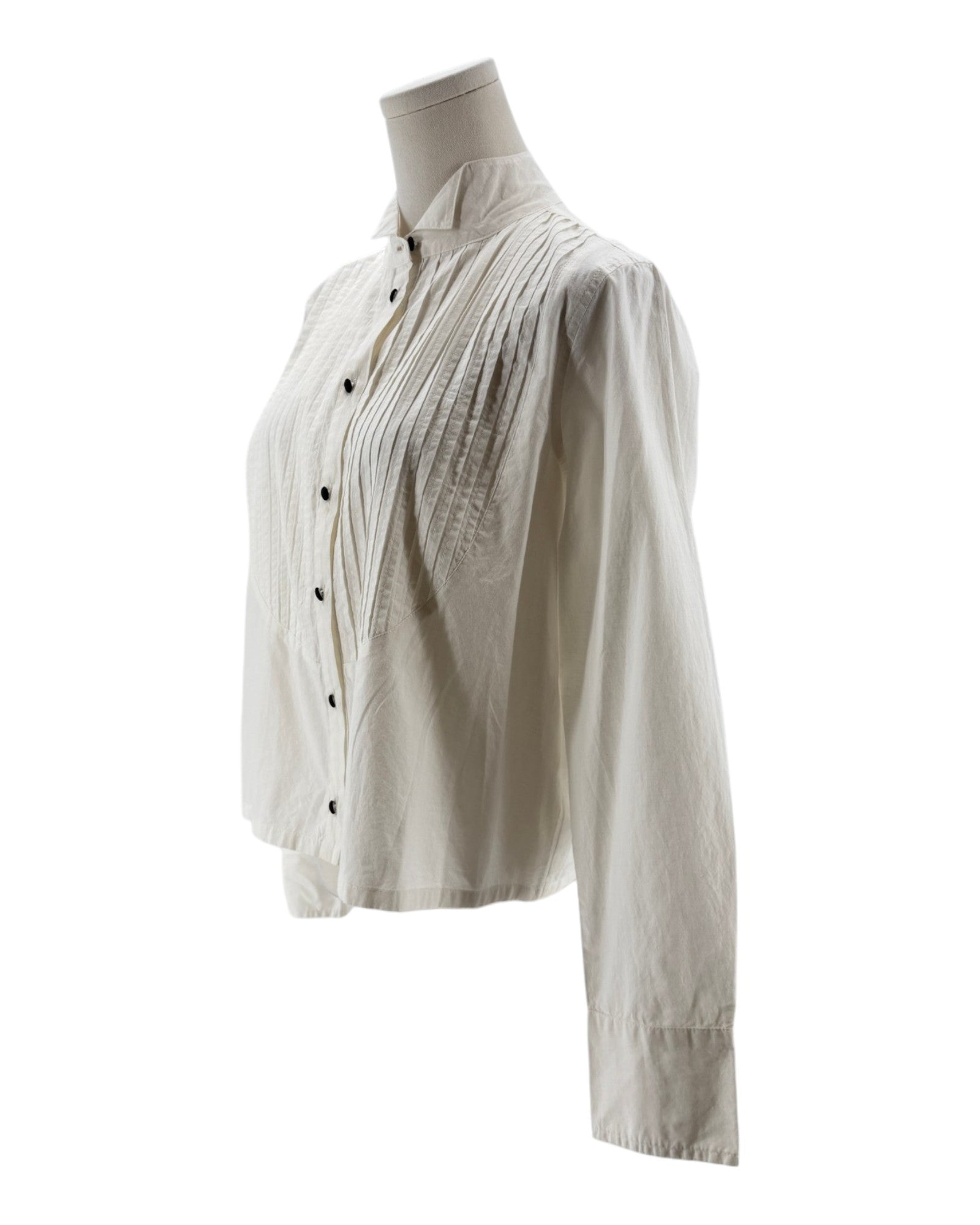 White blouse on a mannequin against a white background