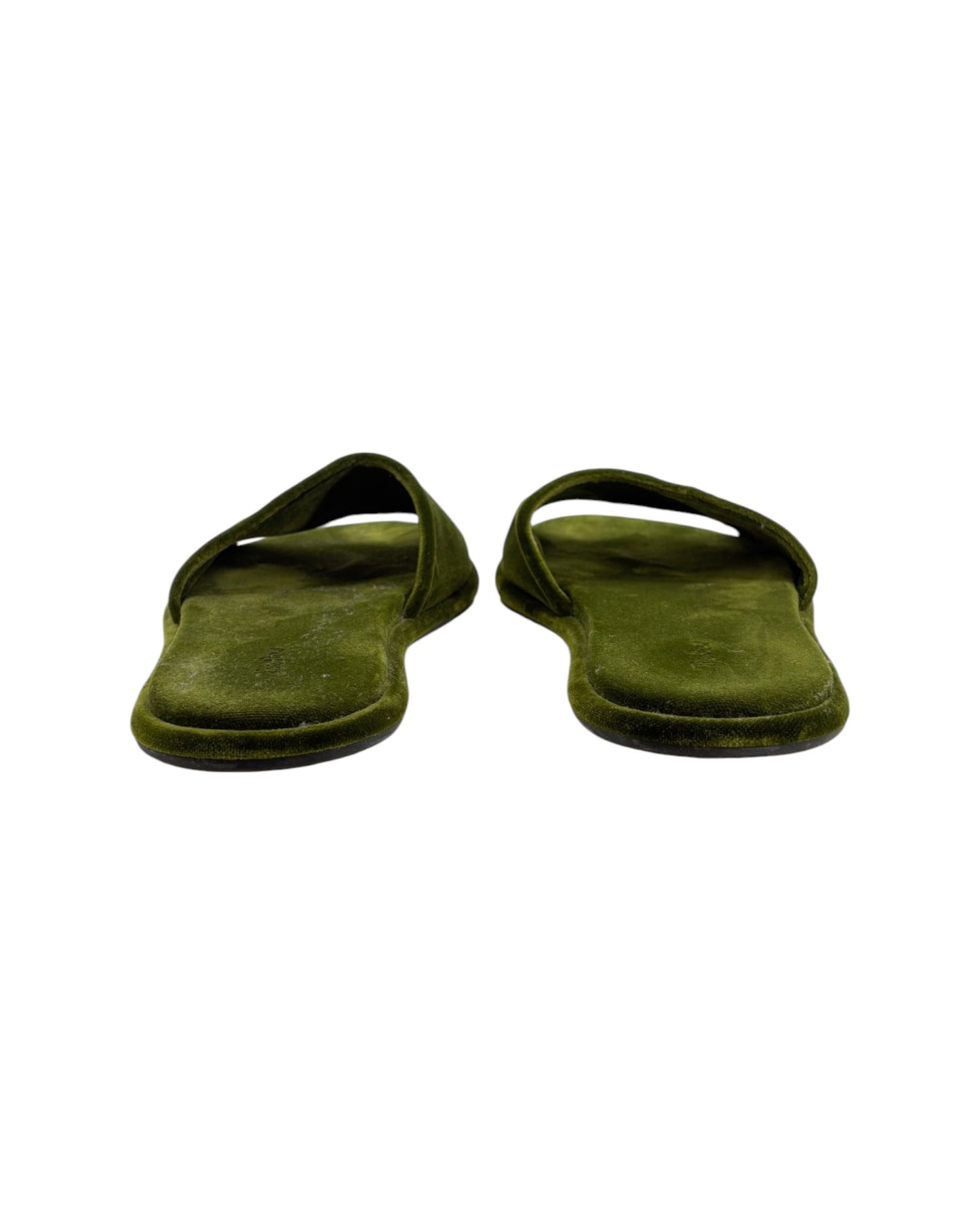 Pair of green slippers on a white background