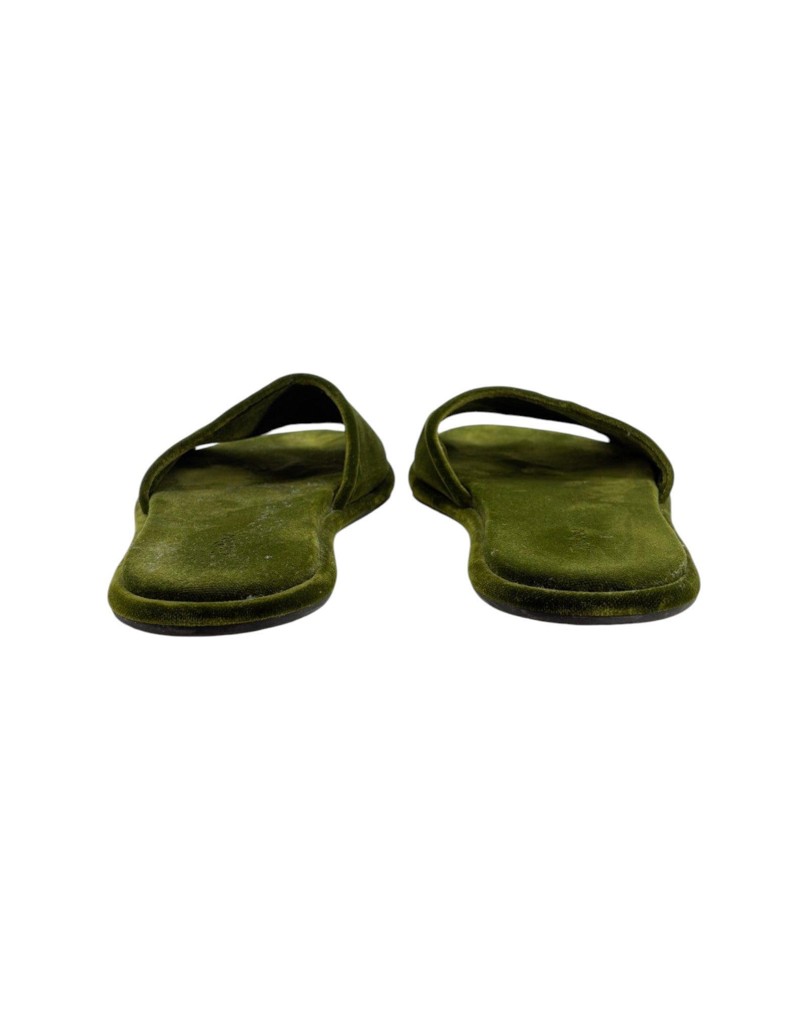 Pair of green slippers on a white background