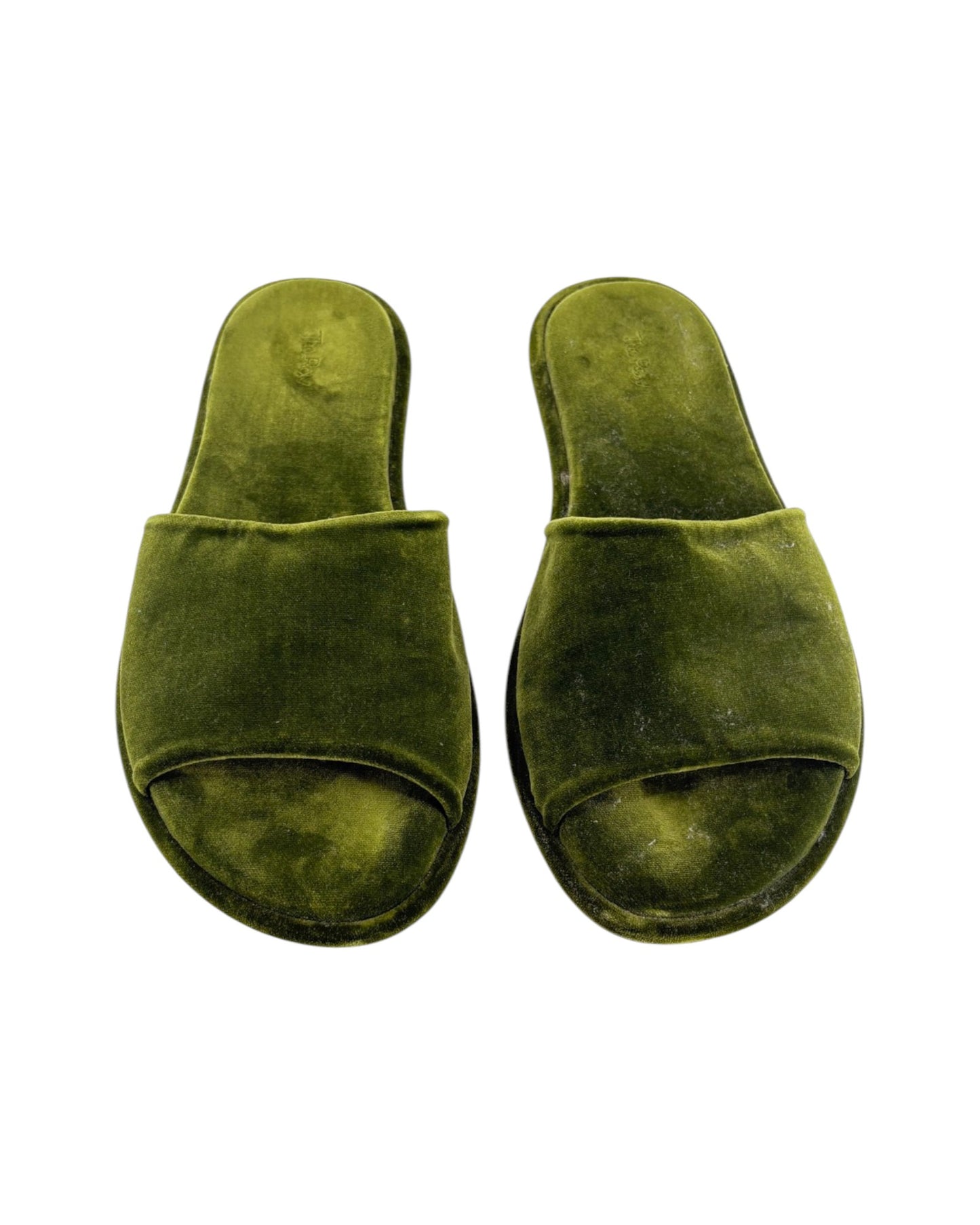Pair of green slippers on a white background