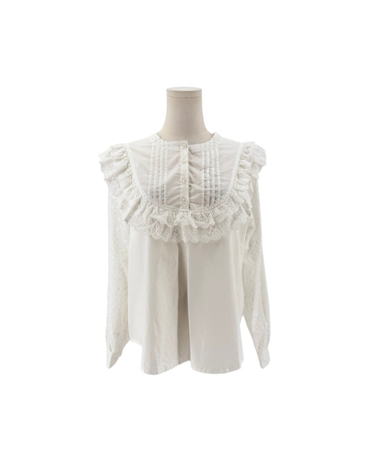 White long sleeve blouse with lace and ruffle details on a mannequin and on a white background